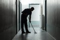 Male Janitor Cleaning Corridor Royalty Free Stock Photo