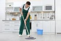 Male janitor cleaning floor with mop Royalty Free Stock Photo