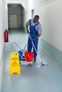 Male Janitor Cleaning Floor Royalty Free Stock Photo