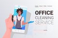 Male janitor man cleaner on smartphone screen self isolation office cleaning service concept horizontal Royalty Free Stock Photo