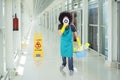 Male janitor with a megaphone in the train station Royalty Free Stock Photo