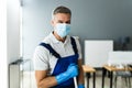 Male Janitor Mopping Floor In Face Mask Royalty Free Stock Photo