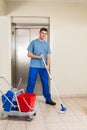 Male Janitor Mopping Floor Royalty Free Stock Photo