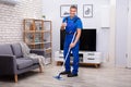 Male Janitor Mopping Floor Royalty Free Stock Photo