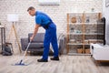 Male Janitor Mopping Floor Royalty Free Stock Photo