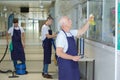 Male janitorial staff cleaning establishment Royalty Free Stock Photo