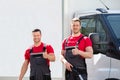 Male Janitors Showing Thumbs Up Sign At Outdoors Royalty Free Stock Photo