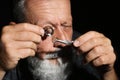 Male jeweler diamond ring in workshop, closeup view