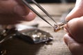 Male jeweler examining diamond ring in workshop, closeup view Royalty Free Stock Photo