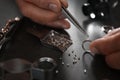 Male jeweler examining diamond ring in workshop Royalty Free Stock Photo
