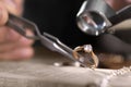 Male jeweler examining diamond ring in workshop Royalty Free Stock Photo