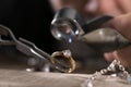 Male jeweler examining diamond ring in workshop Royalty Free Stock Photo