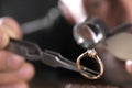 Male jeweler examining diamond ring in workshop Royalty Free Stock Photo