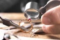 Male jeweler examining ruby ring in workshop Royalty Free Stock Photo