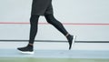 Male jogger training at stadium track. Athlete legs running on racetrack Royalty Free Stock Photo