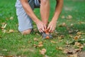 Male jogger tying laces on his shoes outside