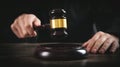 Male judge in a courtroom striking the gavel Royalty Free Stock Photo