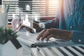 Male judge in a courtroom using laptop on office desk with law icon on VR screen Royalty Free Stock Photo