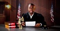 Male Judge Reading Documents While Sitting At Desk Royalty Free Stock Photo