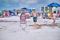 Male kid looking at the Rip Currents warning sign at the Siesta Beach in Sarasota, Florida Royalty Free Stock Photo