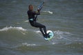 Male Kite Foil Surfer with long hair on the sea. back view close up Royalty Free Stock Photo