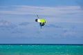 Male Kitesurfer grabing his board
