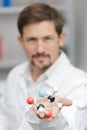 male lab teacher showing 3d dna model Royalty Free Stock Photo