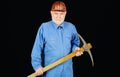 Male laborer with pickaxe. Construction worker, builder or miner with pickax. Mining industry. Royalty Free Stock Photo