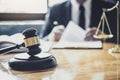 Male lawyer or judge working with contract papers, Law books and wooden gavel on table in courtroom, Justice lawyers at law firm, Royalty Free Stock Photo