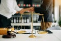Male lawyer in the office with brass scale on wooden table. justice and law concept Royalty Free Stock Photo
