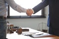 Male lawyer shaking hands with client in office Royalty Free Stock Photo