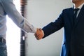 Male lawyer shaking hands with client in office Royalty Free Stock Photo