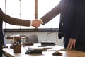 Male lawyer shaking hands with client in office Royalty Free Stock Photo