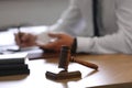 Male lawyer working at table, focus on gavel Royalty Free Stock Photo