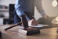 Male lawyer working at table, focus on gavel Royalty Free Stock Photo