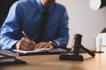 Male lawyer working at table, focus on gavel Royalty Free Stock Photo