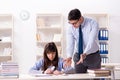 The male lecturer giving lecture to female student Royalty Free Stock Photo