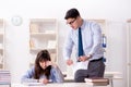 The male lecturer giving lecture to female student Royalty Free Stock Photo