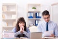 The male lecturer giving lecture to female student Royalty Free Stock Photo