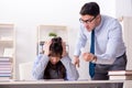 The male lecturer giving lecture to female student Royalty Free Stock Photo