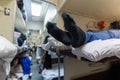 Male legs in black socks in the aisle of a train car