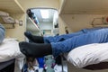 Male legs in black socks in the aisle of a train car Royalty Free Stock Photo