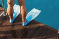 Male legs flippers close up deck yacht Royalty Free Stock Photo