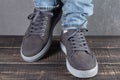 Male legs with gray nubuck leather shoes, concept, as if walking