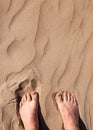 Male legs in hot sand Royalty Free Stock Photo