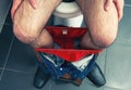 Male legs in toilet