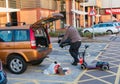 Male loading a diabled persons mobility scooter into the back of Royalty Free Stock Photo