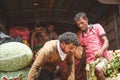 Male loading a truck with vegetable in a market in Colombo, the capital of Sri Lanka