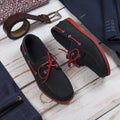 Male loafers, belt and clothes on wooden background. Mens shoes Royalty Free Stock Photo