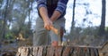 Male logger chopping wood with an axe in the forest 4k